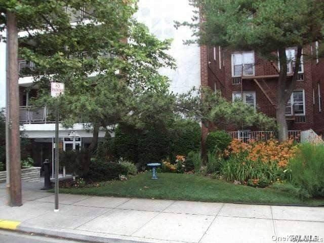 View of property's community featuring a yard