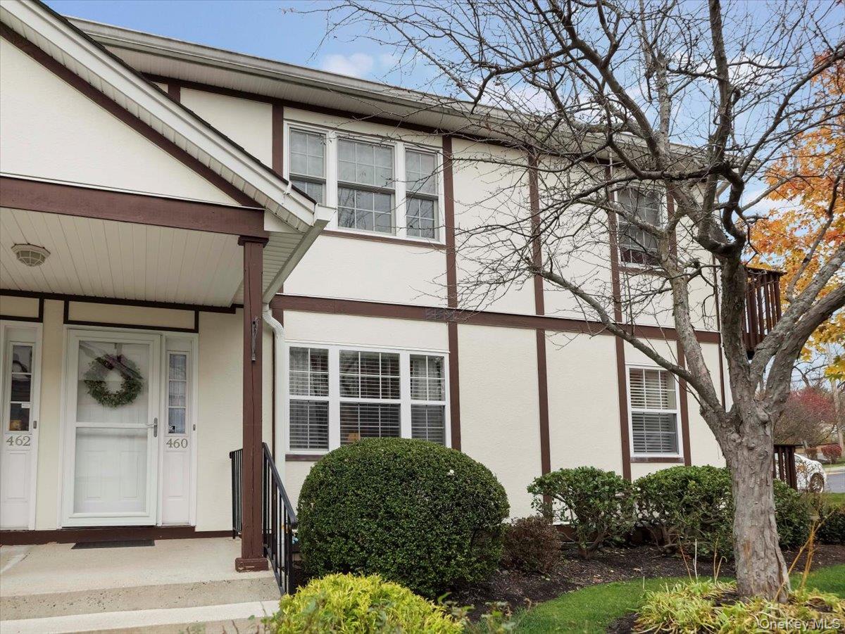 Property entrance featuring stucco siding