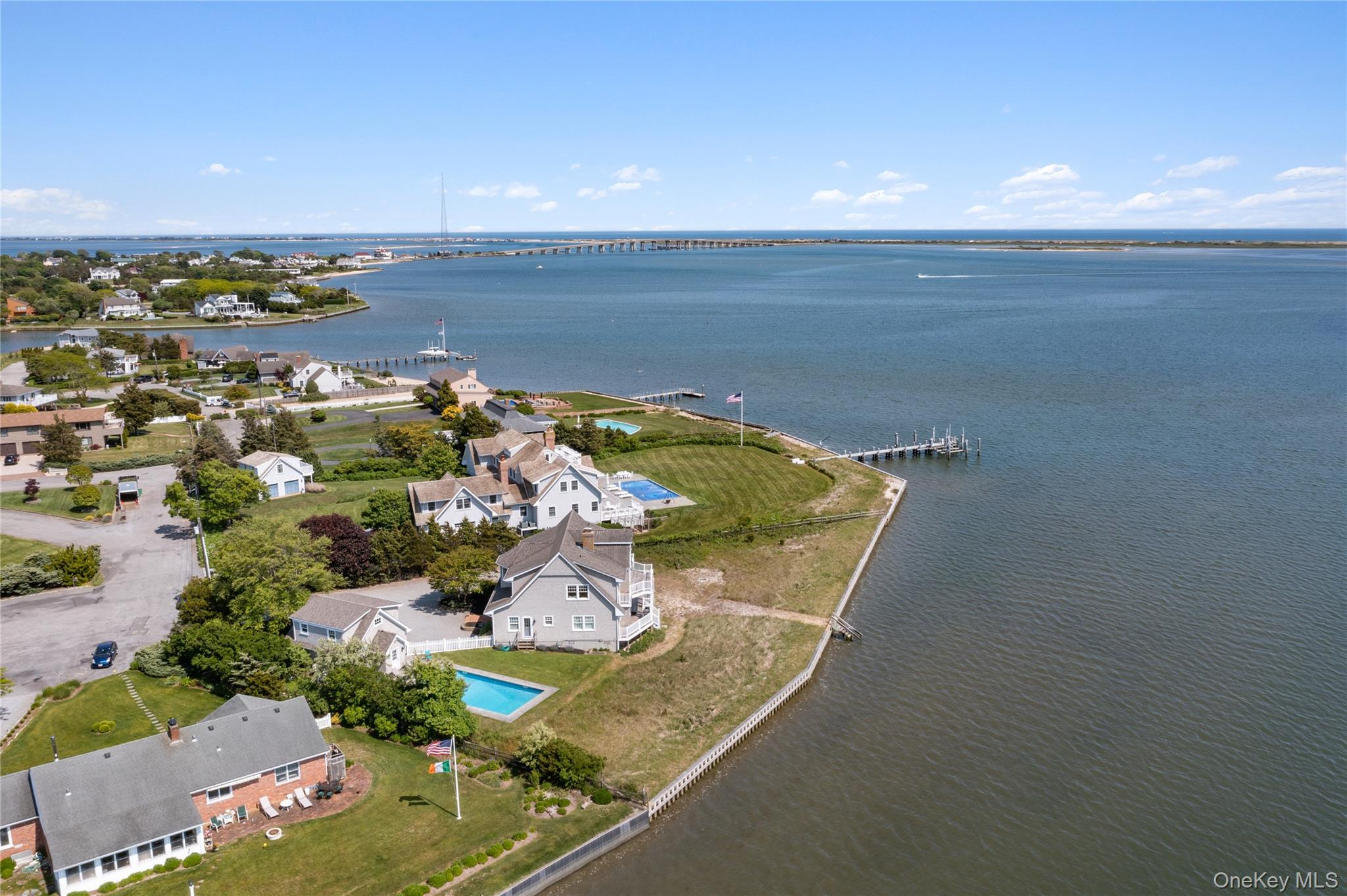 Aerial view of property's location featuring a large body of water