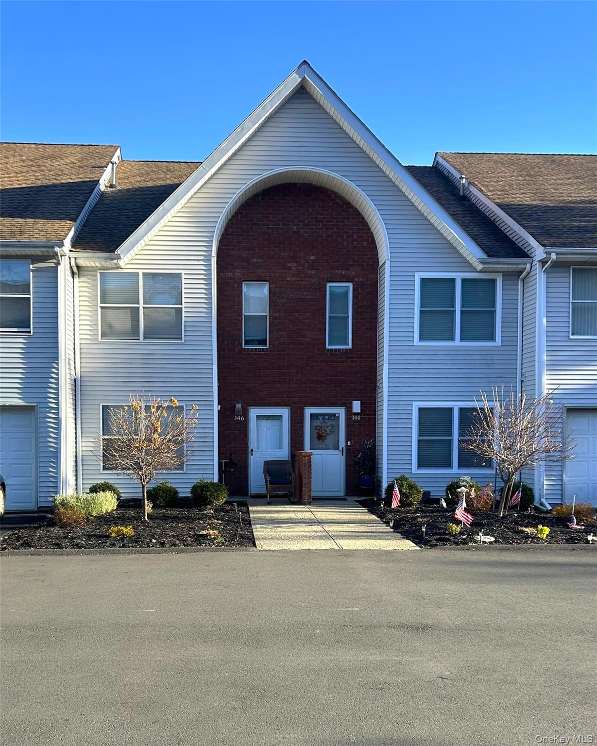 Traditional home featuring brick siding