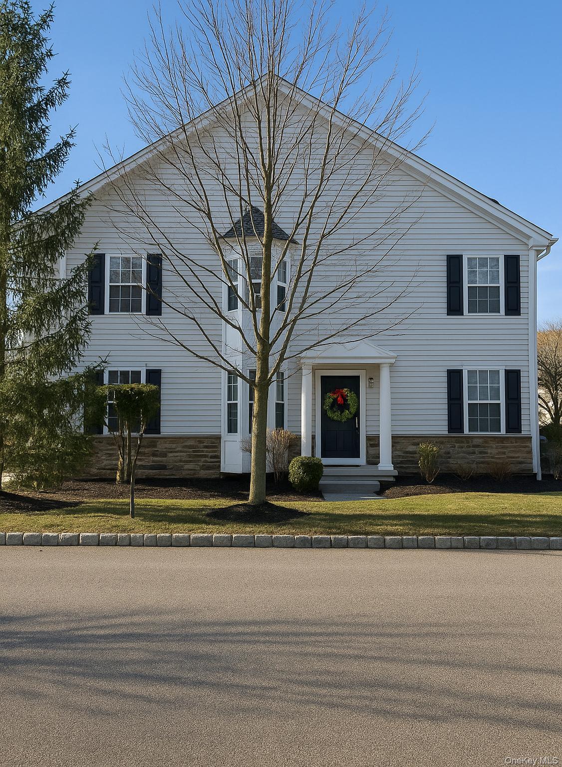 View of front facade with stone siding