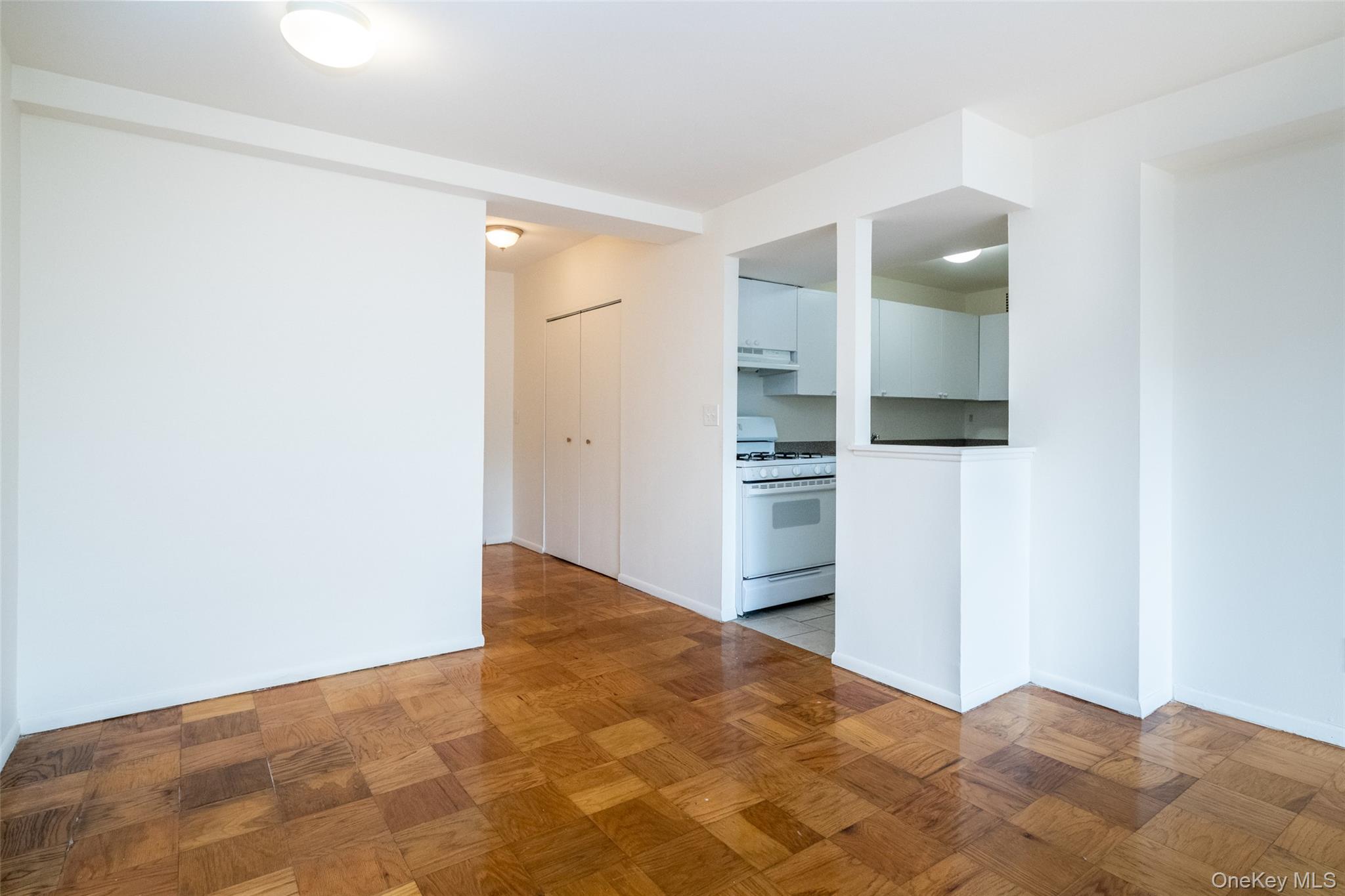 Unfurnished room with baseboards