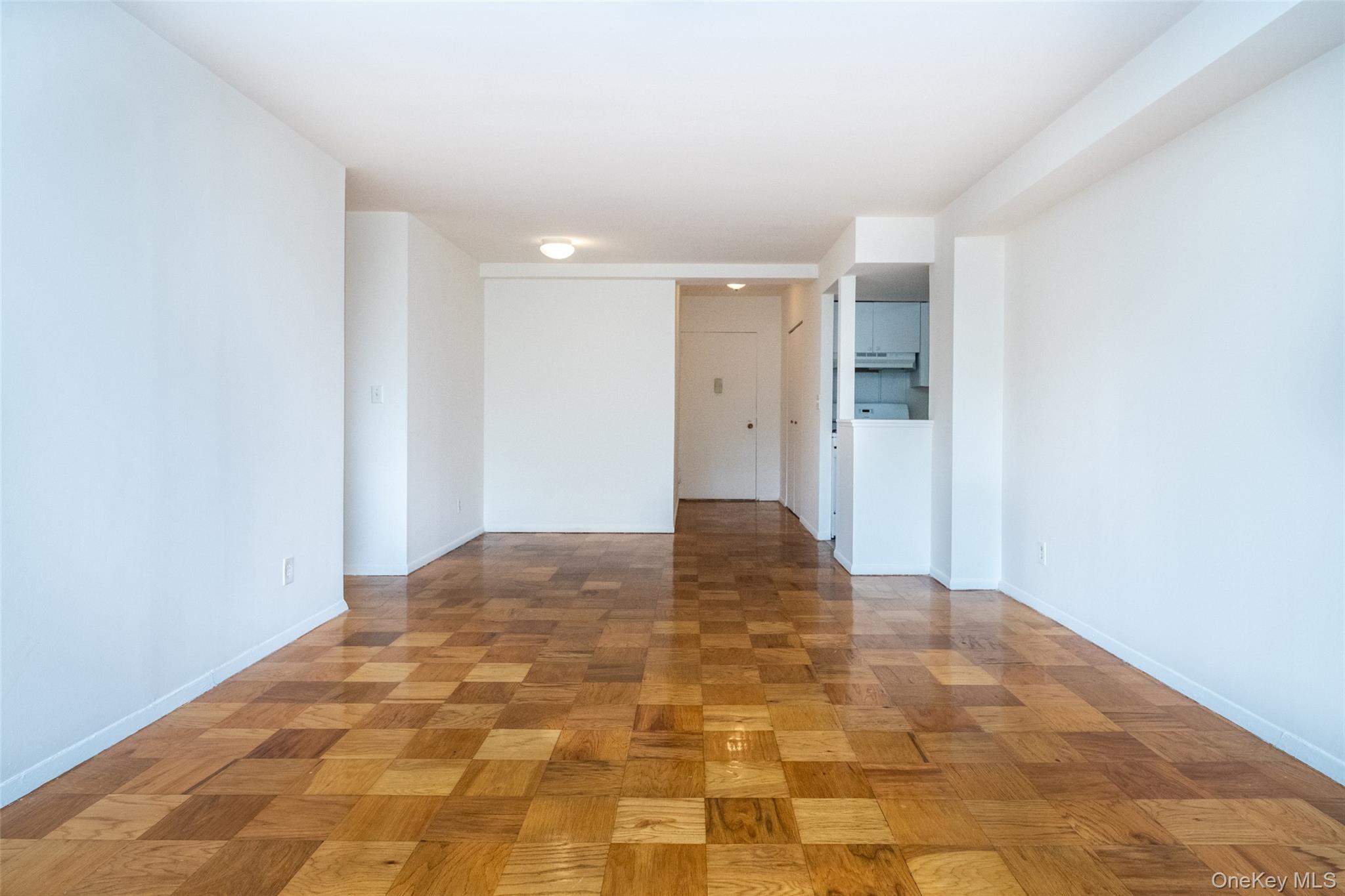 Spare room featuring baseboards
