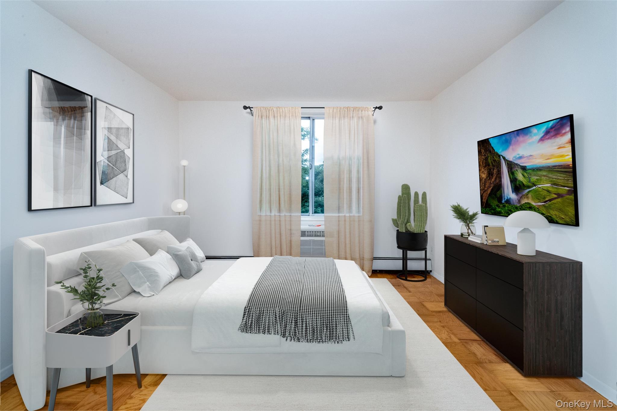 Bedroom featuring a baseboard radiator and baseboards