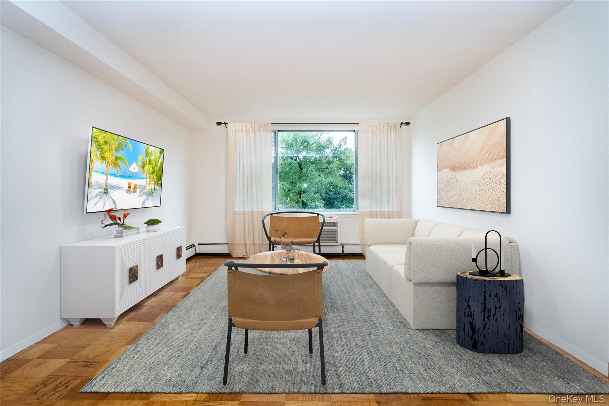 Living area featuring an AC wall unit and a baseboard heating unit