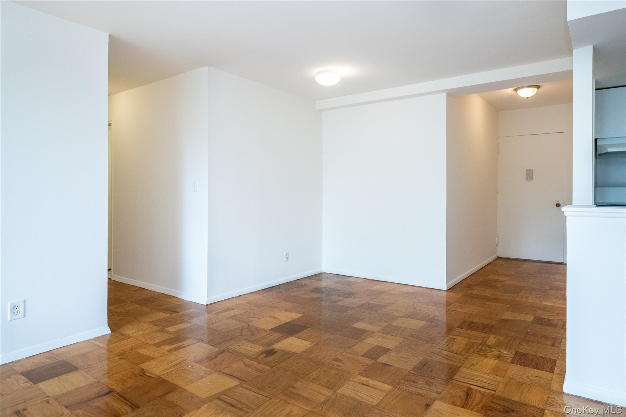 Unfurnished room featuring baseboards