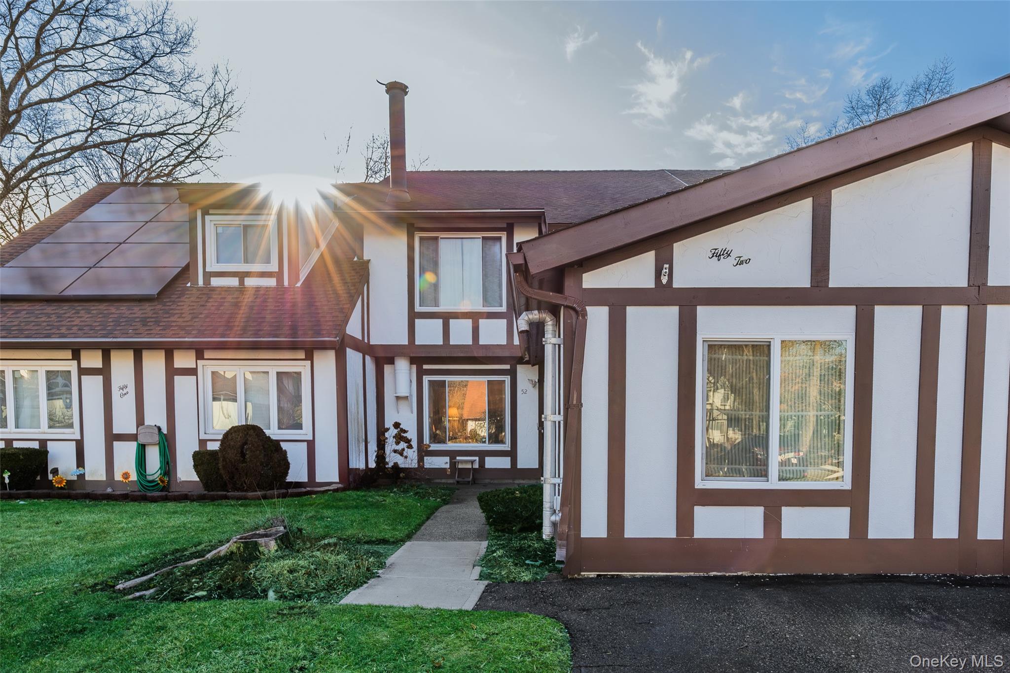 Front of unit with driveway