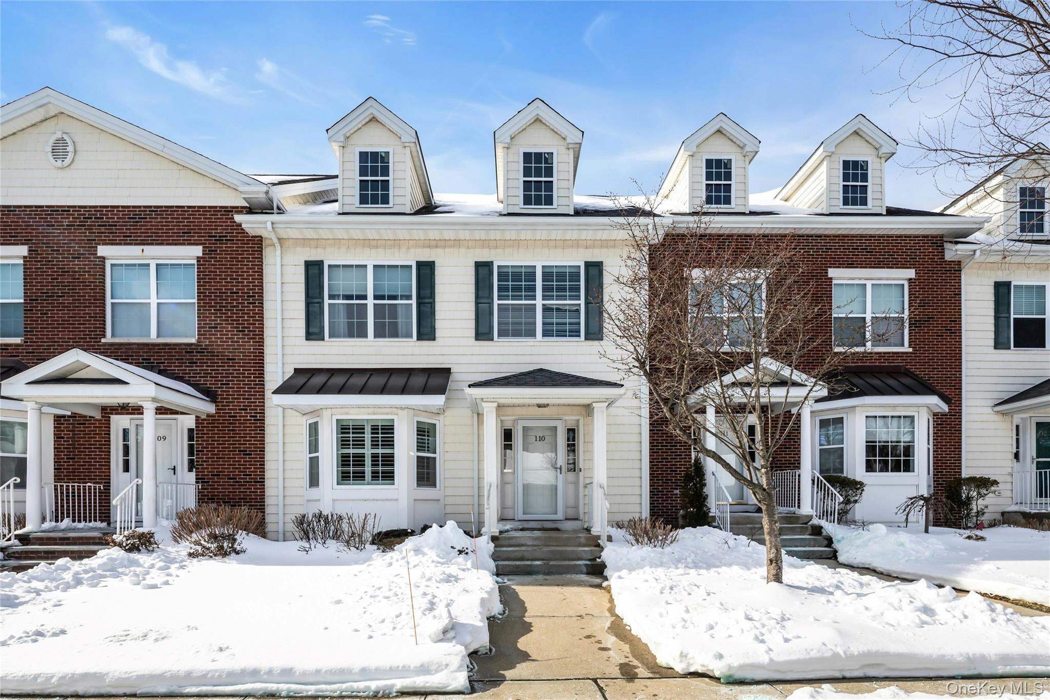Front Exterior-Townhouse with bay window and portico