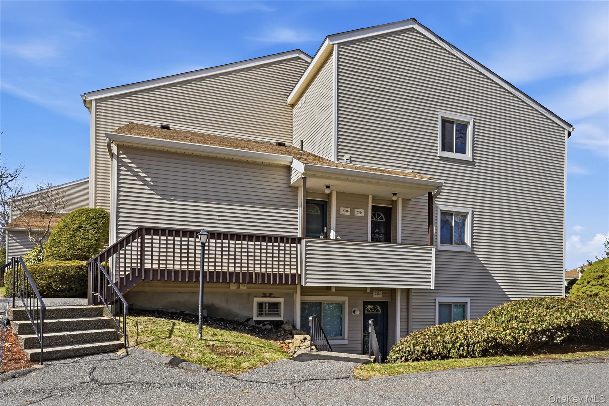 Front of building showing condo entrance door.
