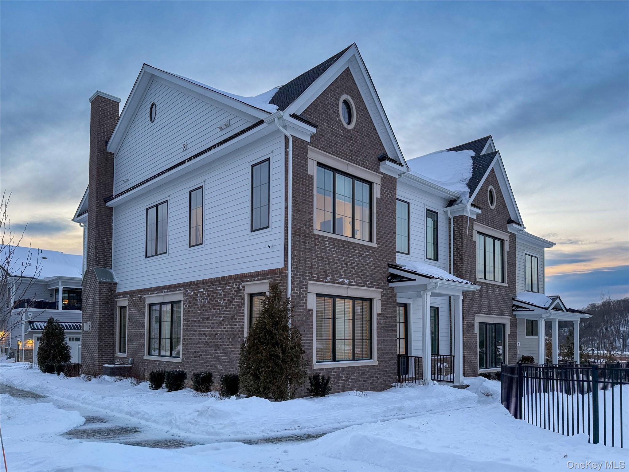 Rare 3-bedroom end-unit in the sold-out Chappaqua Crossing Carriages community, offering refined architecture and exceptional curb appeal.