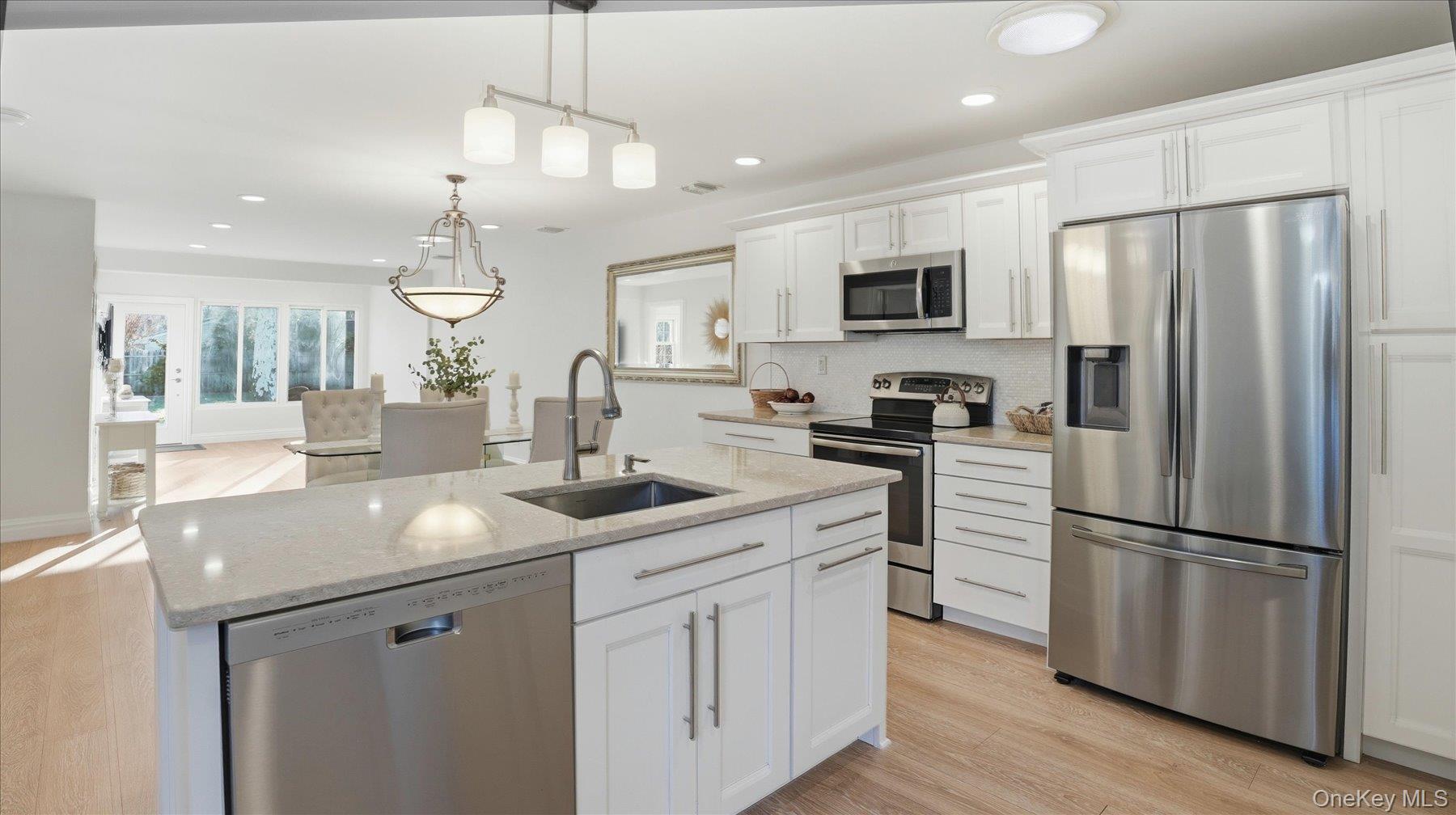 A generously sized kitchen featuring modern stainless-steel appliances, offering both functionality and contemporary style.
