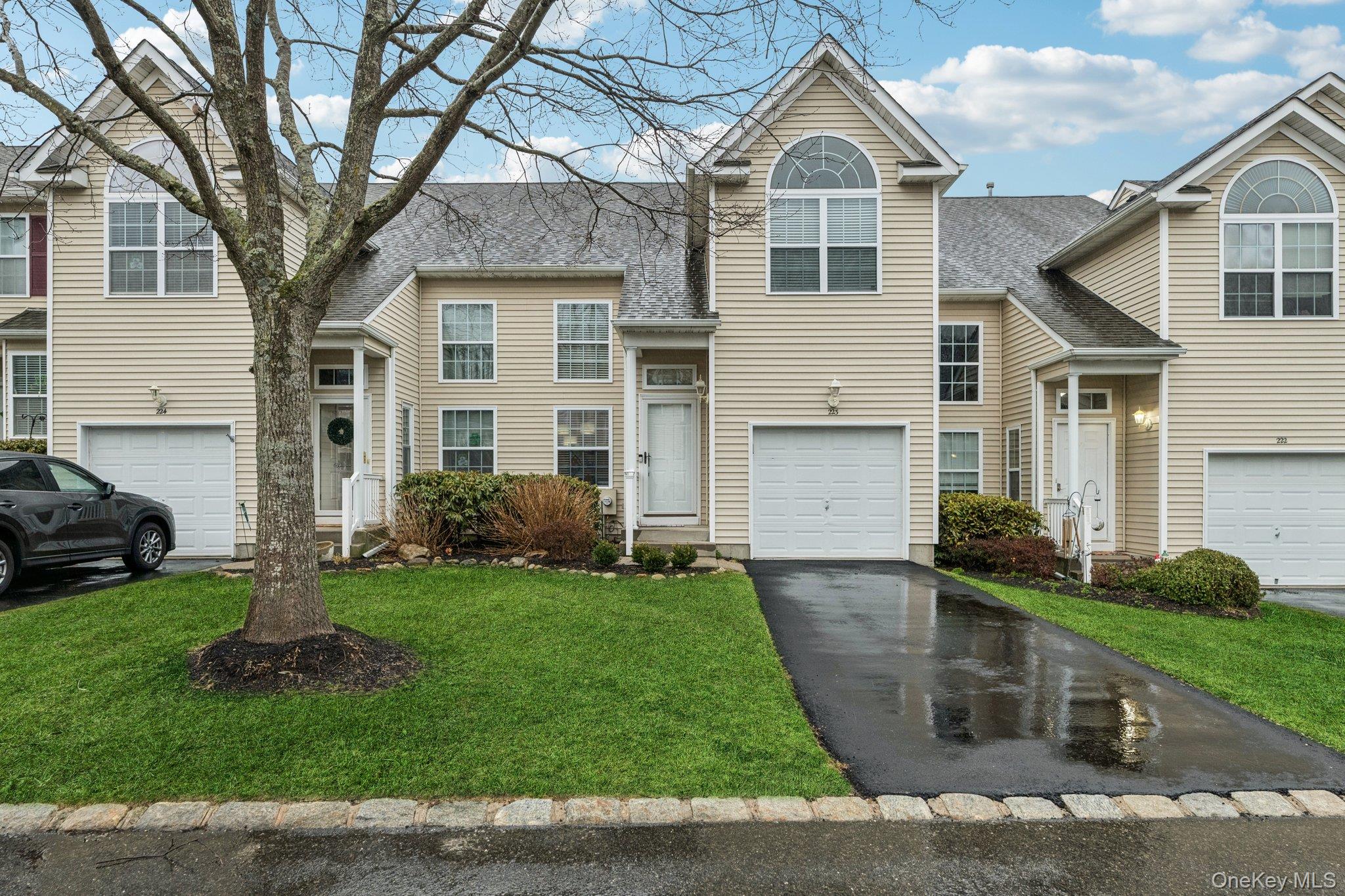 Private entry, private driveway with lovely front lawn