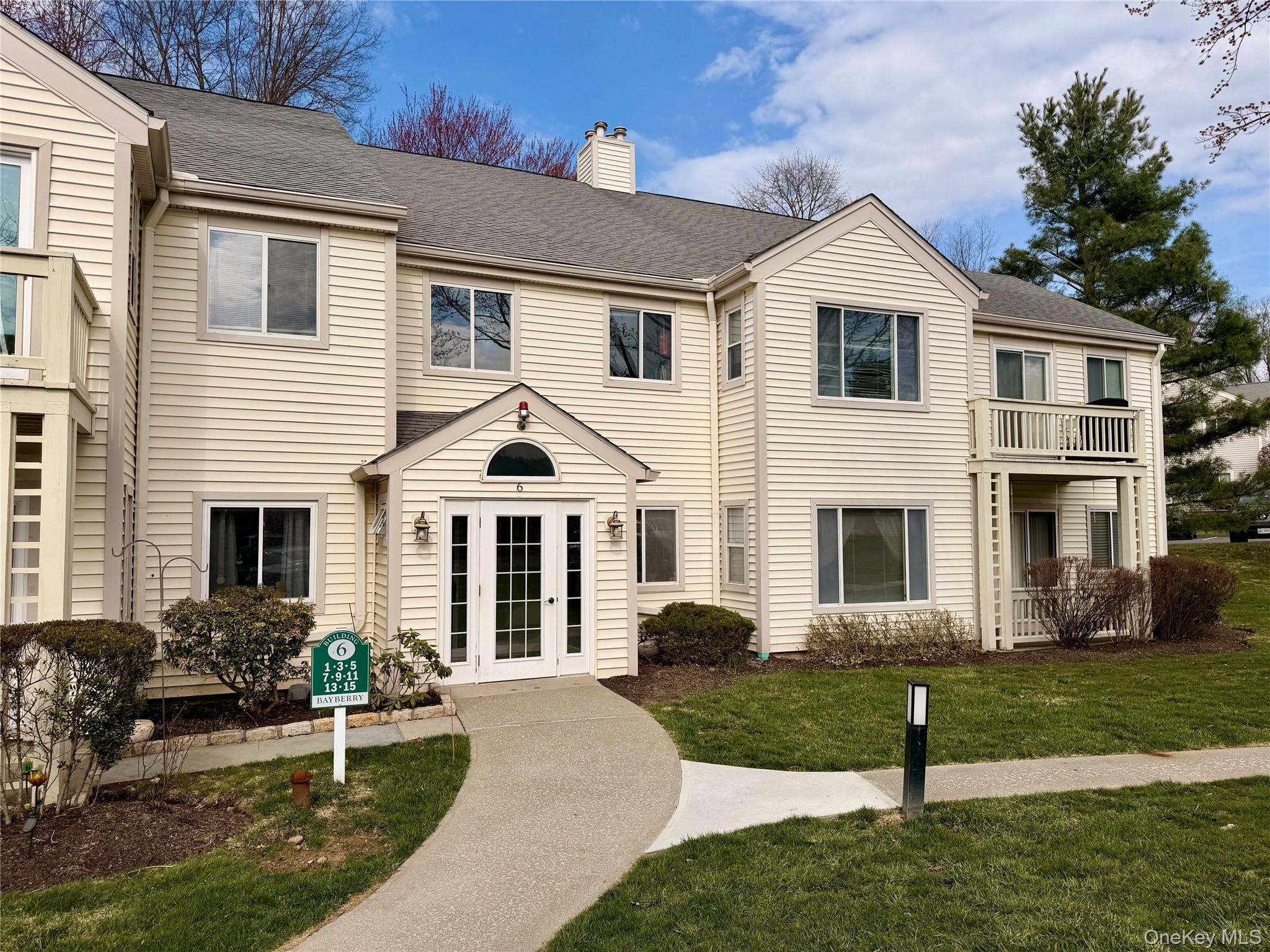 Welcome to 15 Bayberry Drive, a top-floor end unit nestled in the sought-after Chapel Hill community of Peekskill, where easy living meets an unbeatable location.