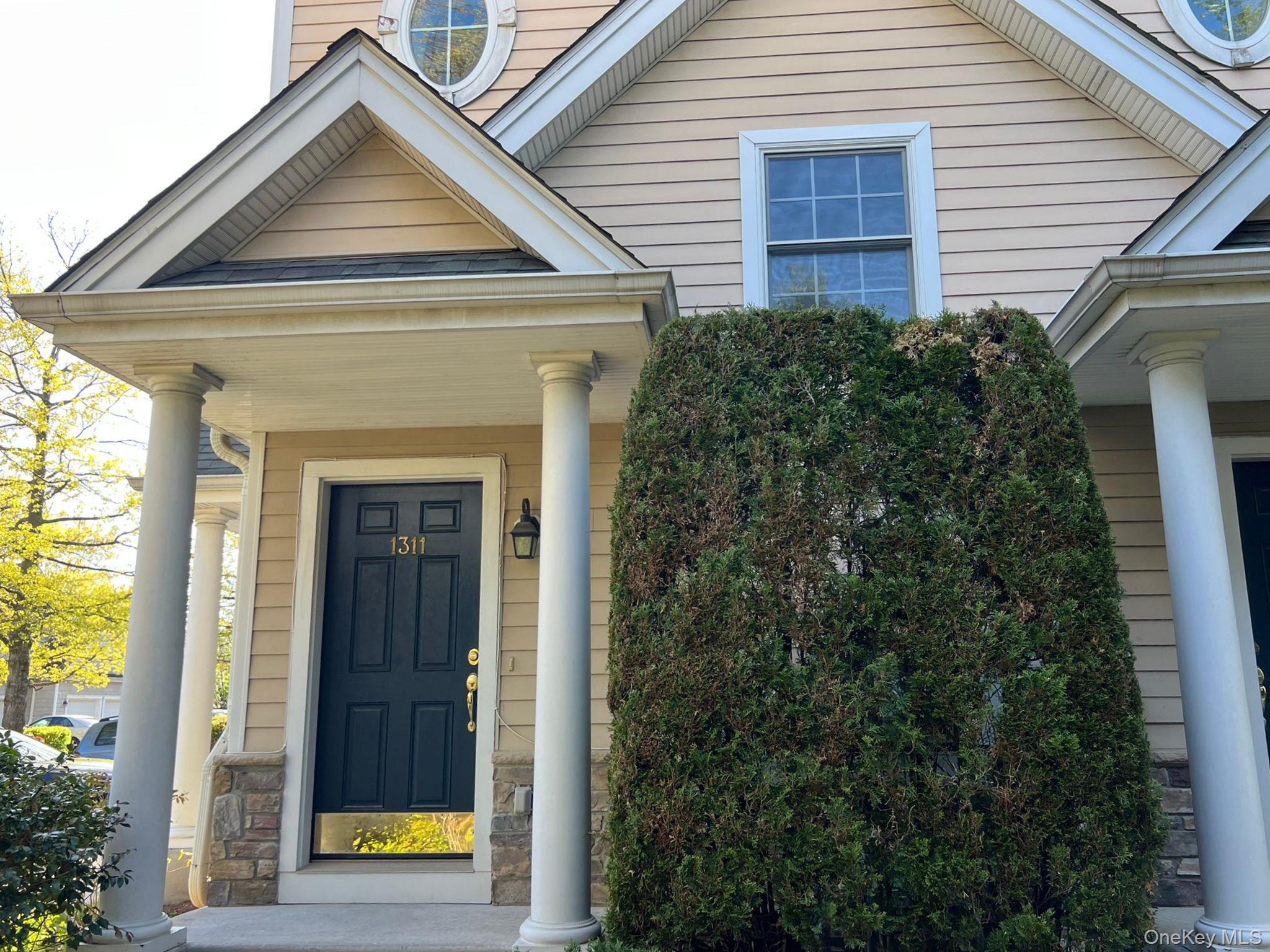 Welcome to 1311 Half Moon Bay. Inviting front entry complemented by beautiful landscaping.
