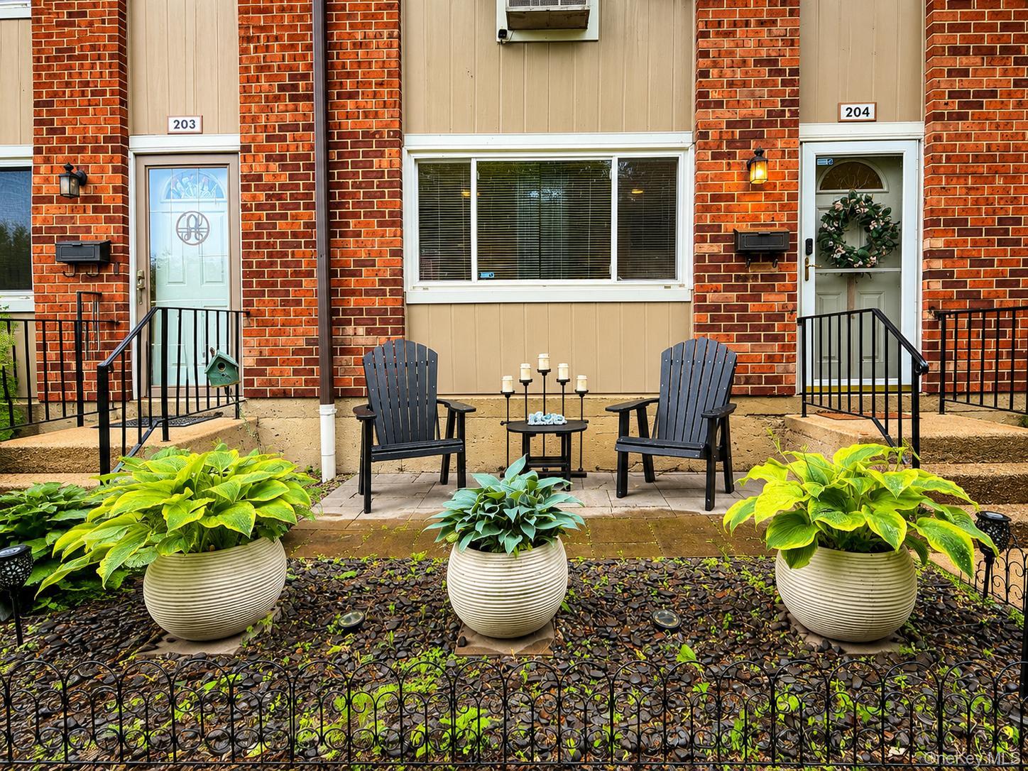 A welcoming front garden creates the comfort & curb appeal of private home living.