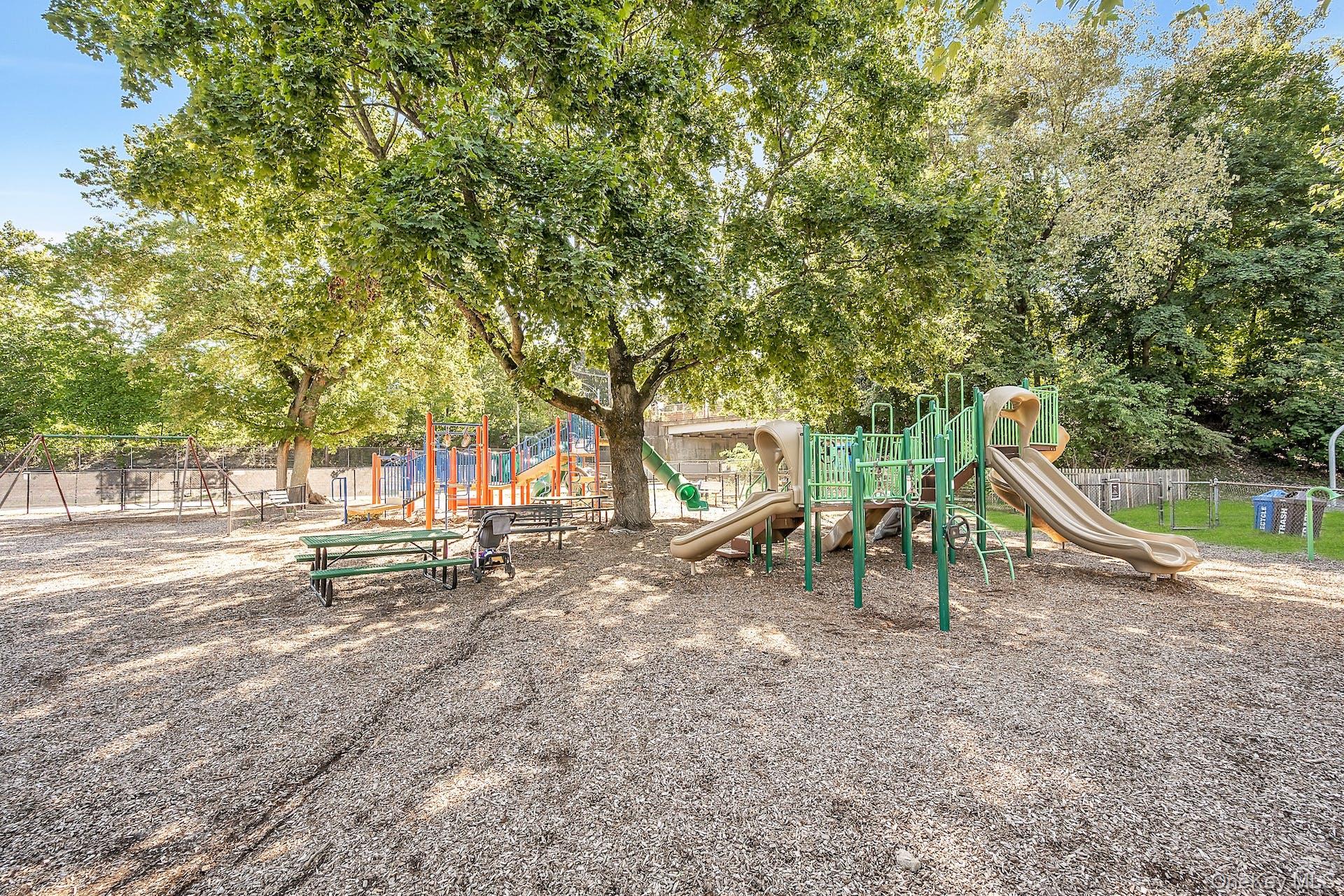 Communal playground featuring fence
