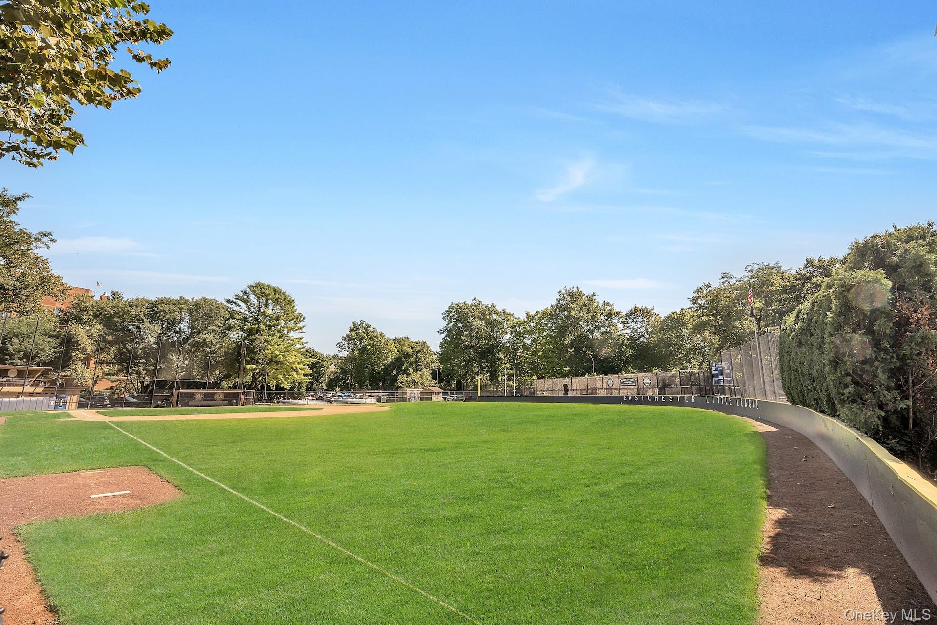 View of home's community featuring fence