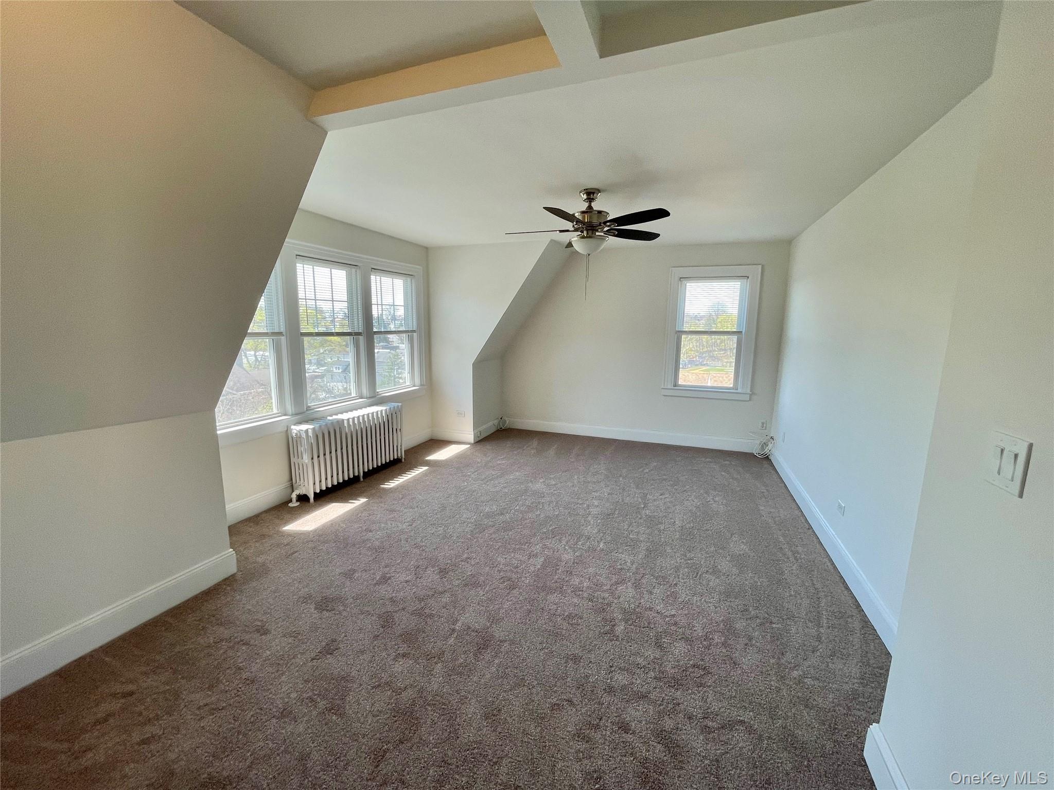 Wider view of living room...new carpeting throughout and freshly painted