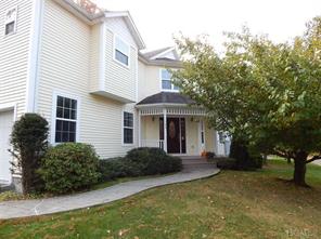 Pretty view of the front of the home, porch, walkway and entrance