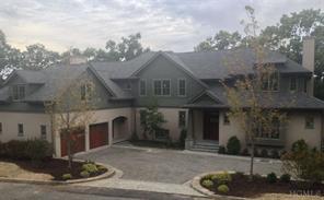5 Stearns Ridge is a shingle and stucco new construction home with seasonal river views.