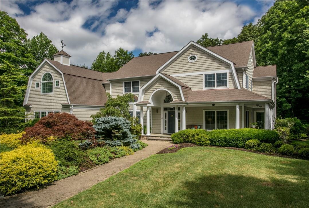 Welcome to 109 Hardscrabble Lake Drive, Chappaqua, a spacious 5-bed/4.1-bath Colonial with three full levels of finished living spaces, wraparound front porch & 3-car garage, set privately on 1.5+ landscaped acres.