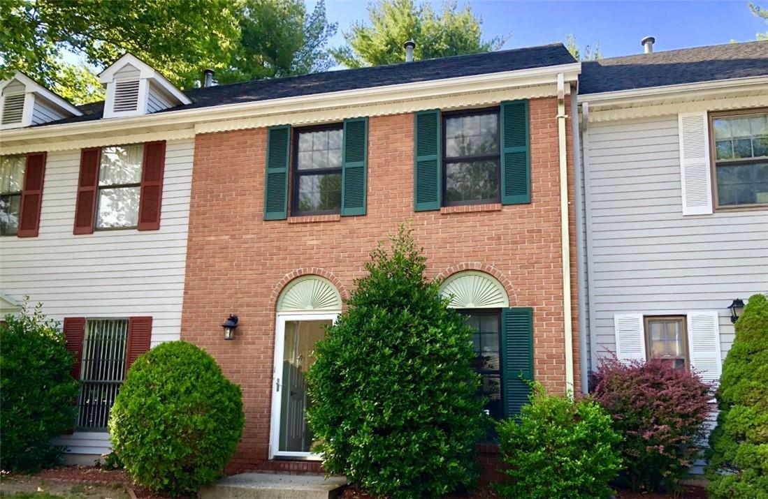 Beautiful brick front of condo.